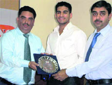 RIMT principal Dr Harsh Sadawarti honours guest speaker Navraj S Chohan in Mandi Gobindgarh on Friday.