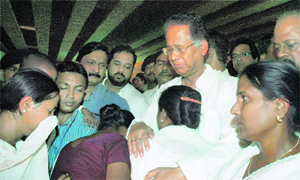 Chief Minister of Assam Tarun Gogoi embraces family members of Guwahati serial blast victims on its first anniversary at the Ganeshguri blast site in Guwahati on Friday.