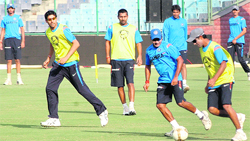 Indian team members at a practice session at Ferozshah Kotla in New Delhi