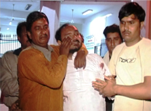 Relatives of the priest grieve his death at a hospital in Gurgaon.