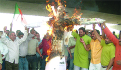 Delhi BJP activists protest against the rise in bus fares and milk prices in New Delhi on Saturday. 