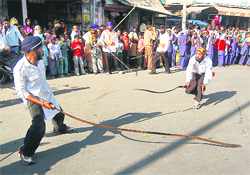 Devotees perform gatka during a nagar kirtan on Guru Nanak Dev Parkash Utsav in Dehradun on Saturday.