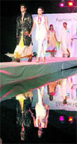 Models walk the ramp to promote khadi during a fashion show in Kochi on Sunday