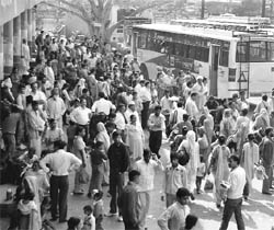 Devotees crowd the bus stand at Ambala Cantonment as the buses provided by the administration for the Kapal Mochan mela seem inadequate.
