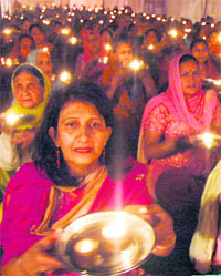 Devotees perform mass aarti on the occasion of Hanuman jayanti at Sector 22, Chandigarh, on Sunday.
