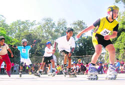 Students participate in a roller-skating competition in Dehradun on Sunday. 