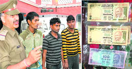 Miscreants with fake currency at Kotwali Police Station in Haridwar on Sunday.