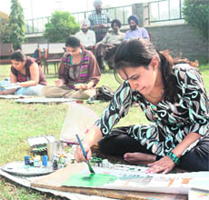 Students take part in a poster-making contest during the ongoing PAU youth festival in Ludhiana on Sunday.
