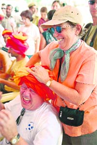 Foreign tourists take part in a turban-tying contest at Pushkar