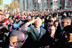 Former US President Bill Clinton (centre) greets ethnic Albanians during his visit to Pristina, Kosovo, on Sunday. 