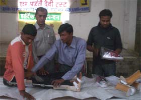 A technician of the Lala Durga Charan Artificial Limbs Centre, Ambala, adjusting an artificial limb to a physically-challenged person at a camp in Fazilka
