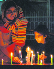Devotees light candles on the occasion of Gurpurab at Sector 8 gurdwara in Chandigarh on Monday.