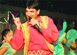 An artiste performs at the craft mela in Kalagram. 