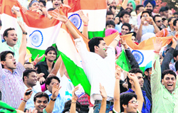 Fans cheer for India during the One-Day International cricket match against Australia at the PCA Stadium in Mohali on Monday.