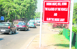 The notice board ahead of the Zirakpur barrier on the Chandigarh-Ambala Highway, alerting motorists to roll down windowpanes.
