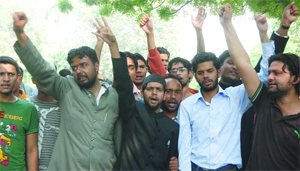 Students of Aligarh Muslim University and other central universities protest against the sudden closure of AMU, at Jantar Mantar in New Delhi on Monday. 