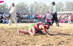 a wrestling bout in progress at Parade Ground, Dehradun