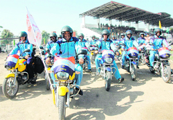 A police motorcycle rally takes off in Dehradu