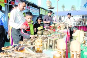 People buy bamboo products at Saras Mela at Parade Ground in Dehradun