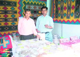 Kamal Arya with his son display herbs and ayurvedic medicines at Saras Mela in Dehradun