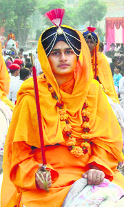 A Sikh girl astride a horse during a Shobha Yatra, on the birth anniversary of Guru Nanak Dev, in Faridabad