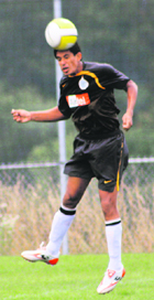 Manandeep in action during a match.