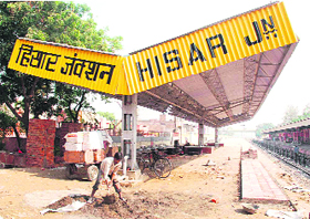A labourer working at one of the two platforms under construction at Hisar railway station. The commissioning of the platforms has been delayed by several months due to the slow pace of work.