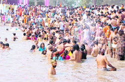 Followers of Baba Jito take a holy dip in Jhiri village on the outskirts of Jammu 