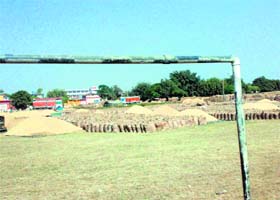 Paddy dumped on the playground of Government Senior Secondary School for boys in Sandhol, Fatehgarh Sahib