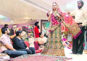 An NRI family has a look at the dresses at a shop in Ludhiana