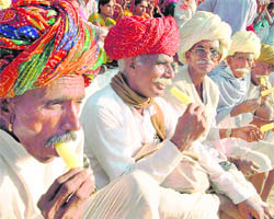 Villagers enjoy ice-cream on the last day of the Pushkar Fair in Ajmer on Monday.