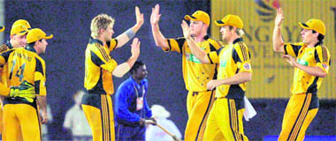 Australian players celebrate their victory over India at the PCA stadium in Mohali on Monday.