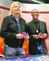Sir Richard Branson (L), with AC Milans Clarence Seedorf during a news conference in Italy on Monday.