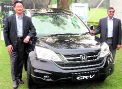 Tatsuya Natsume (L), director, marketing, and Jnaneswar Sen, vice-presidient, marketing, Honda Siel Cars India, at the launch of new Honda CR-V in New Delhi on Tuesday. The car is priced between Rs 21 lakh and 24 lakh and comes in three variants.