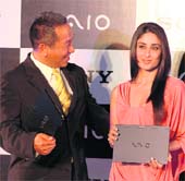 Bollywood actress Kareena Kapoor and managing director of Sony India Masaru Tamagawa pose with Sony's lightest and ultra-slim Vaio X notebook at its launch in New Delhi on Tuesday. The notebook is just half-inch thin and 655 gms in weight