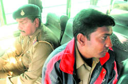 Sub-inspector Gurbeen Singh (extreme left) and the home guard jawan.