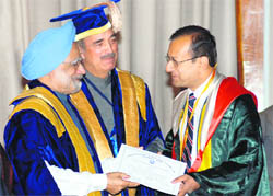 Prime Minister Dr Manmohan Singh awards gold medal to a doctor at the PGIMER on Tuesday. Union Health Minister Ghulam Nabi Azad is also seen in the picture.