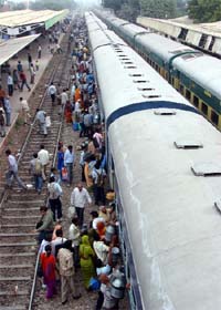 Passengers remain stranded at Gurgaon railway station after trains got delayed due to an accident near Hailey Mandi