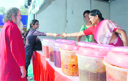 A woman entrepreneur sells pickles at Saras Mela-09 in Dehradun 