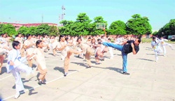 Martial arts expert Sameer Singh trains girls at a school in Jammu.
