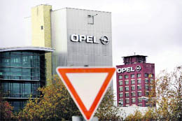 A traffic sign is seen in front of the headquarters of German car manufacturer Opel in Ruesselsheim on Wednesday. The board of General Motors has decided not to sell its Opel unit to Canadian auto parts maker Magna. GM confirmed the decision made by its 13-member board after a meeting of directors on Tuesday in Detroit. 