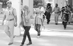 The police take the girls accused of being involved in flesh trade from the Dera Bassi court