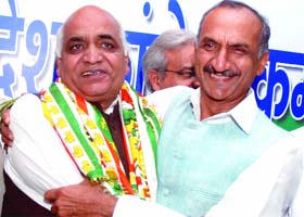 BJP councillor from Timarpur Surender Singh Chaudhary with DPCC president J.P. Aggarwal at Rajiv Bhawan in New Delhi