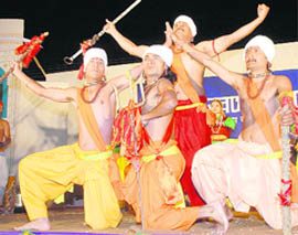 Artistes from the Pinder valley in Chamoli district perform Pandav Dance at Saras Mela in the Parade Ground in Dehradun on Wednesday. 