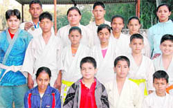 Dehradun sub-junior judo team poses after winning maximum golds at the State-Level Judo Championship in Dehradun on Wednesday.