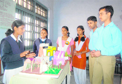 A student explains her model at a science exhibition at Government Girls School, Rajpur Road, Dehradun