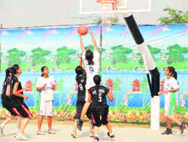 DPS girls score a point over the GRD Academy, Ludhiana, in the CBSE Cluster Basketball Championship at Mullanpur.