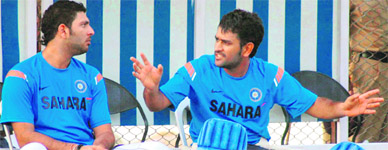 MS Dhoni (R) with Yuvraj Singh during a practice session in Hyderabad on Wednesday.