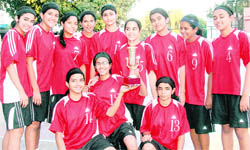 The Welham Girls School team with trophy in Dehradun on Thursday.