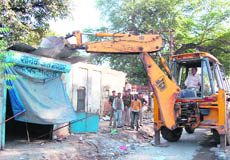 An anti-encroachment drive under way in the Rishikul area in view of the Maha Kumbh. 